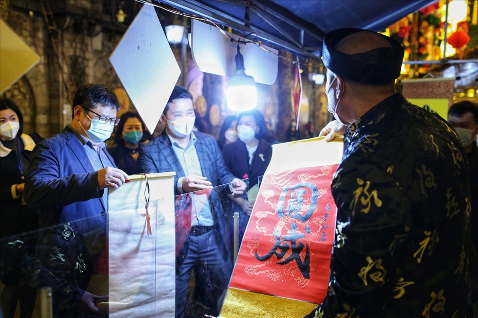 Visitors purchase calligraphy works to wish for luck, happiness, and prosperity moving into the Lunar New Year.