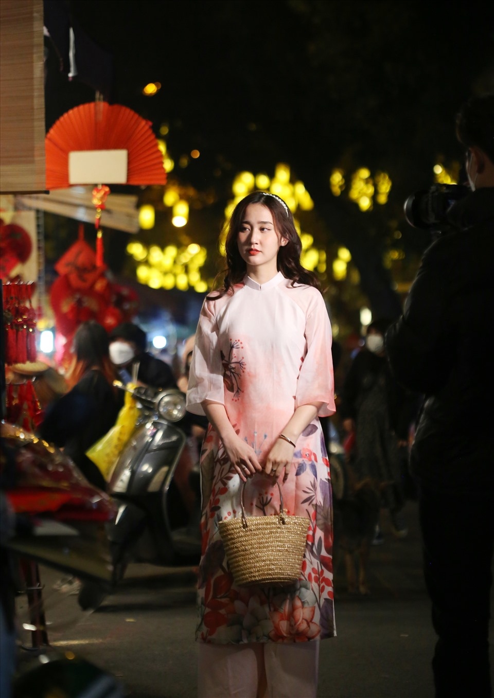 A young girl poses for a photo at the oldest flower market in Hanoi.