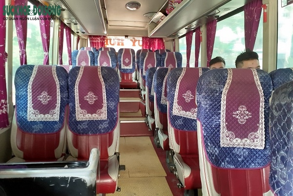 A bus only carries two passengers onboard.