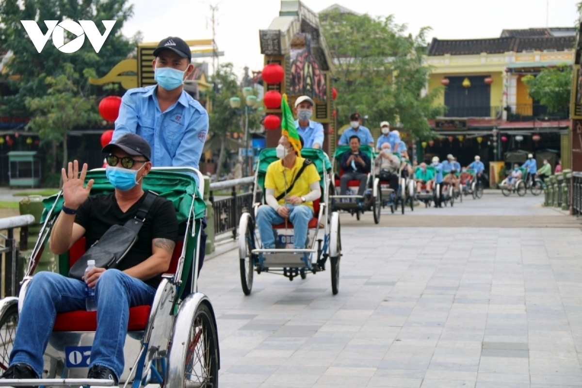 Foreign tourists travel around UNESCO-recognised Hoi An ancient town in November 2021.