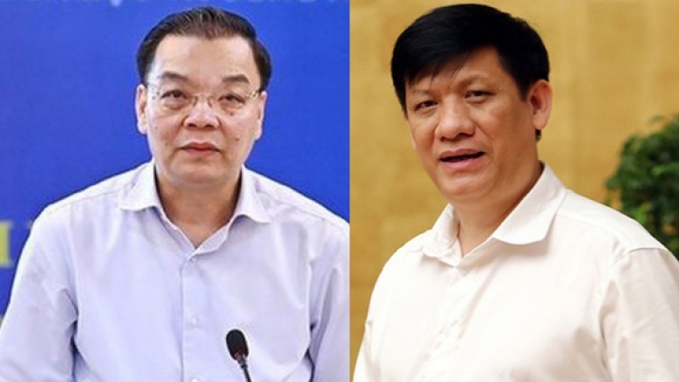 Hanoi Mayor Chu Ngoc Anh (L) and Health Minister Nguyen Thanh Long, who are both Party Central Committee members, are said to be held accountable for wrongdoings linked to the Viet A test kit scandal.