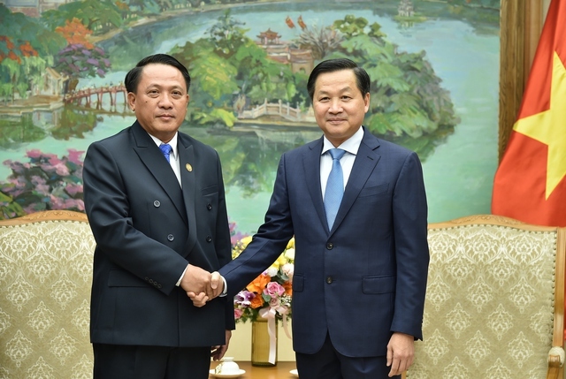 deputy pm receives lao finance minister in hanoi picture 1