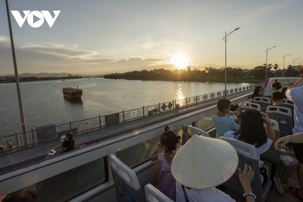 taking a tour of hue on double-decker bus picture 13