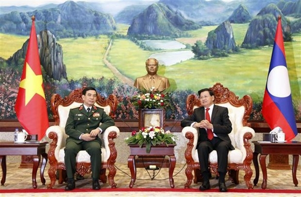 lao leaders welcome visiting defence minister of vietnam picture 1