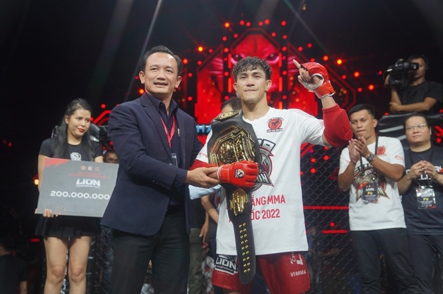 duy nhat wins inaugral 60kg lion championship mma belt picture 1