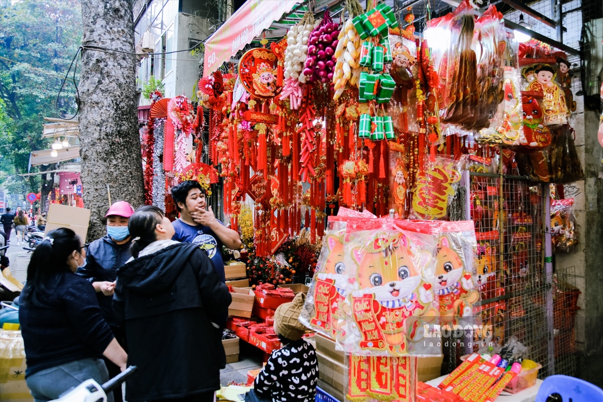 hang ma street decked out in red for tet celebrations after christmas picture 2