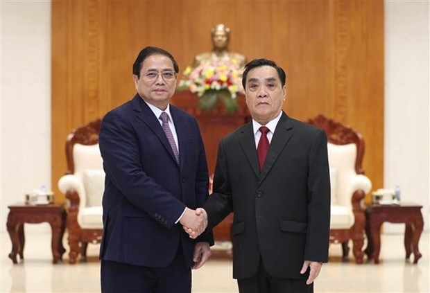 pm pham minh chinh visits former leaders of laos picture 2