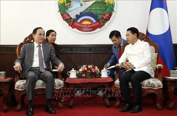 senior lao leaders receive vietnamese party delegation picture 1