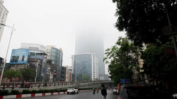 high-rise buildings hidden amid dense fog in hanoi picture 3