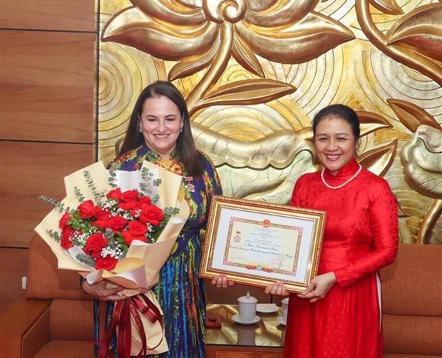 un women representative in vietnam awarded friendship insignia picture 1