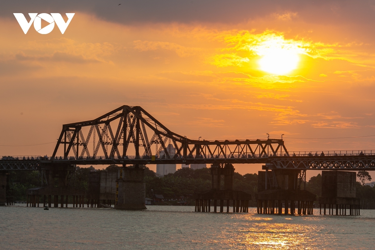 A view of Long Bien Bridge at sunset from Ngoc Lam wharf