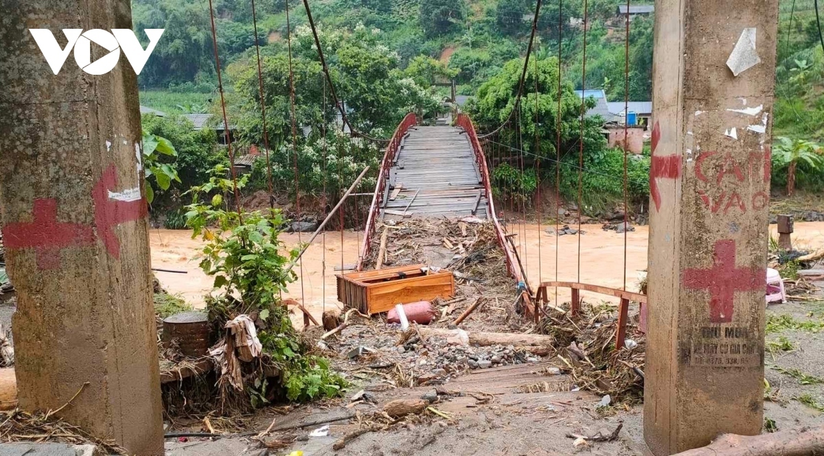 A bridge has been damaged by flashfloods and landslides.