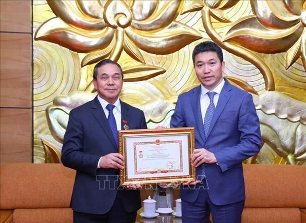 vufo president presents insignia to lao ambassador picture 1