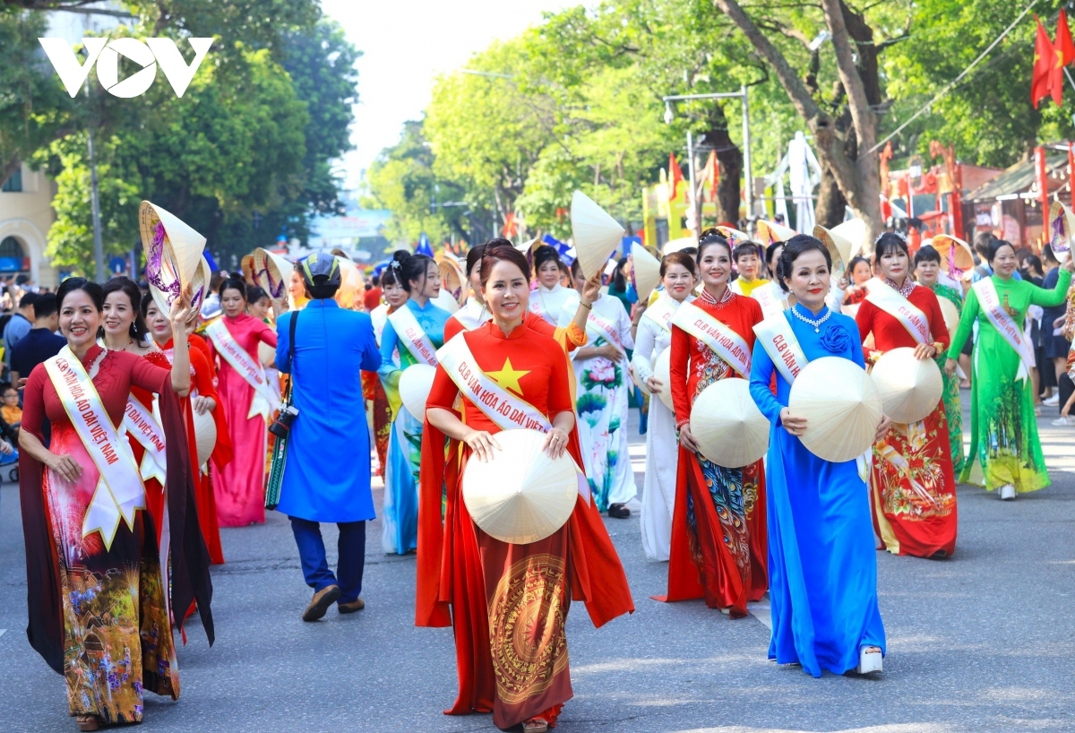 The carnival includes a parade of people in Ao Dai (Vietnamese traditional long dress).