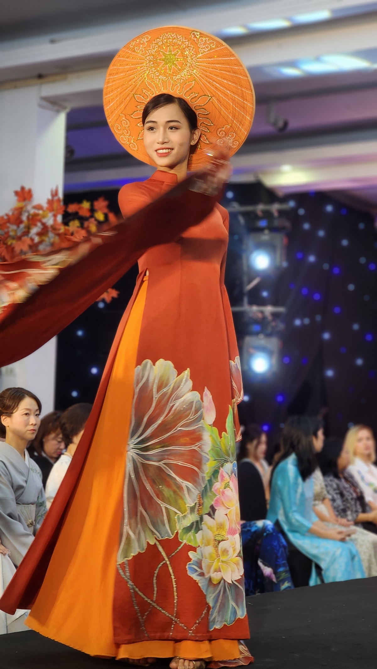 Designer Lan Vy brings a collection of Ten Ao Dai inspired by the lotus flower and Vietnamese legends to the event.