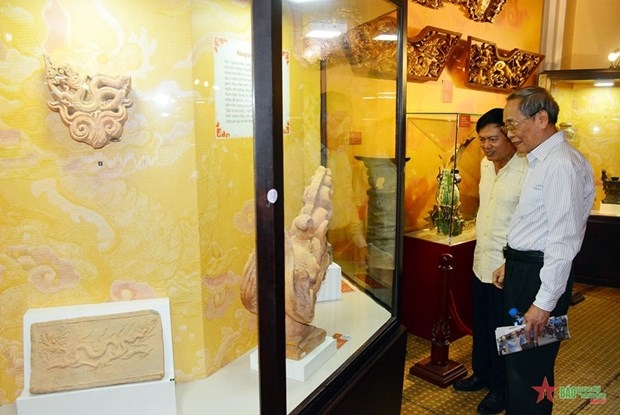 antiques with dragon images displayed in hcm city picture 1