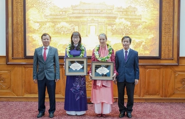 two foreigners awarded honorary citizenship title of thua thien hue picture 1