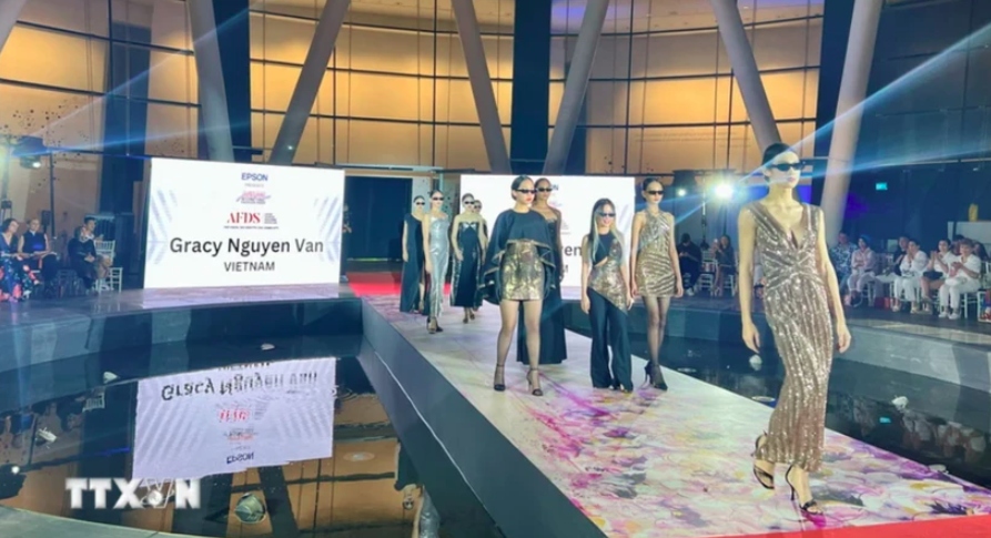 vietnamese designers, models attend asean international fashion week picture 1