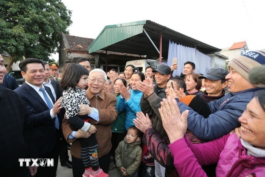 party leader nguyen phu trong and vietnamese people in photos picture 1