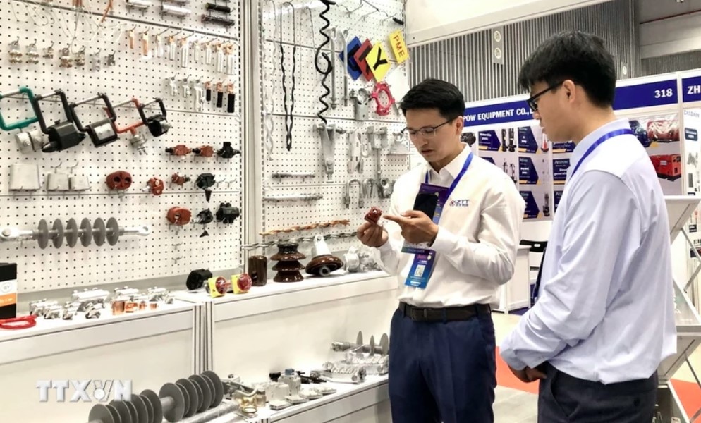 over 300 firms attend int l expos on electrical technology and energy in hcm city picture 1