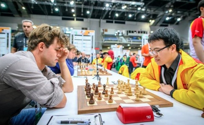 quang liem overwhelmed by magnus carlsen at chess olympiad 2024 picture 1