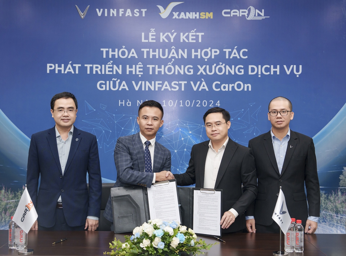 vinfast hop tac voi caron holdings mo chuoi xuong dich vu xe dien tren toan quoc hinh anh 1