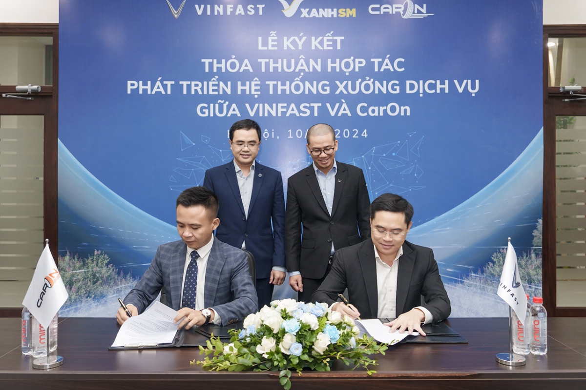 vinfast hop tac voi caron holdings mo chuoi xuong dich vu xe dien tren toan quoc hinh anh 2