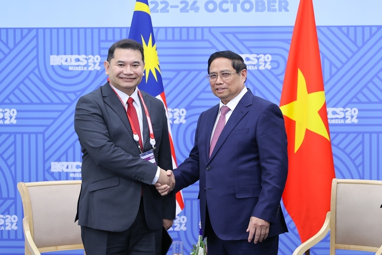 thu tuong pham minh chinh tiep truong doan, bo truong kinh te malaysia rafizi ramli hinh anh 1