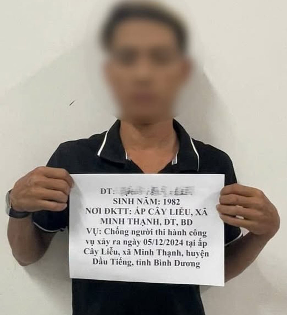 tam giu tai xe chong doi, tong vao xe luc luong cong an o binh duong hinh anh 1
