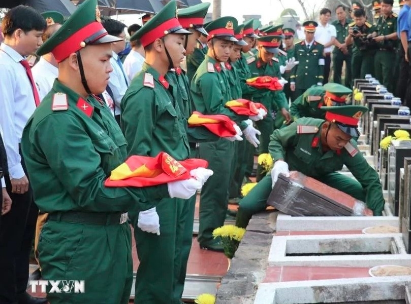 solemn funeral held for 66 martyrs in binh phuoc picture 1