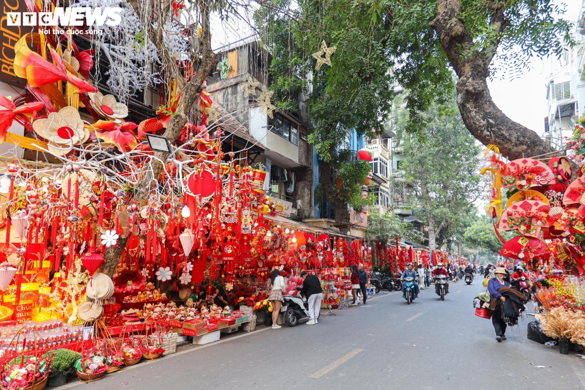 hang ma street decked out in red for tet celebrations picture 1