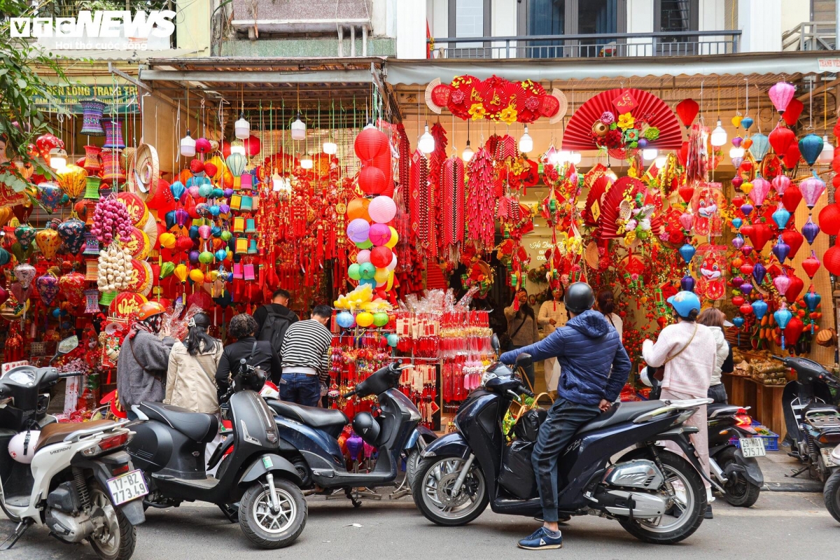 hang ma street decked out in red for tet celebrations picture 12