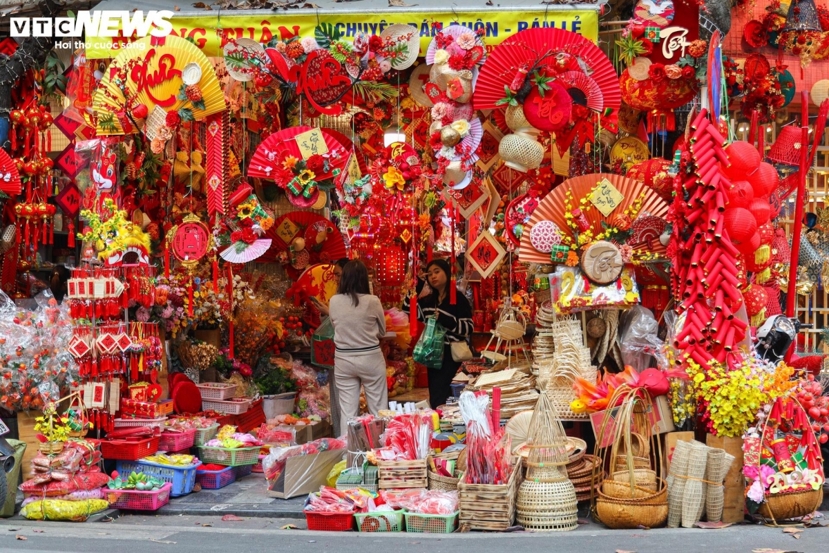 hang ma street decked out in red for tet celebrations picture 2