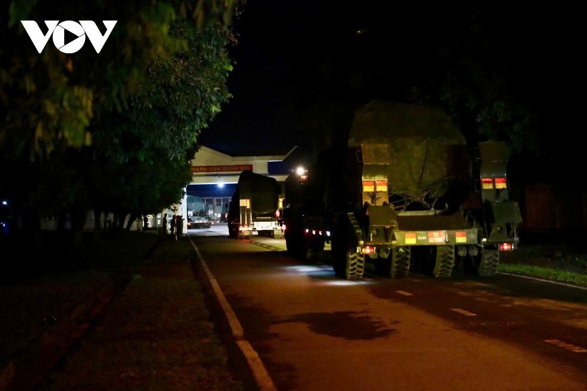 convoy of military hardware moves into hanoi city centre at night for military parade picture 2