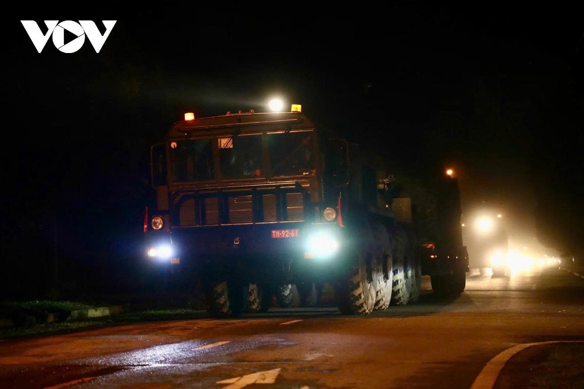 convoy of military hardware moves into hanoi city centre at night for military parade picture 9