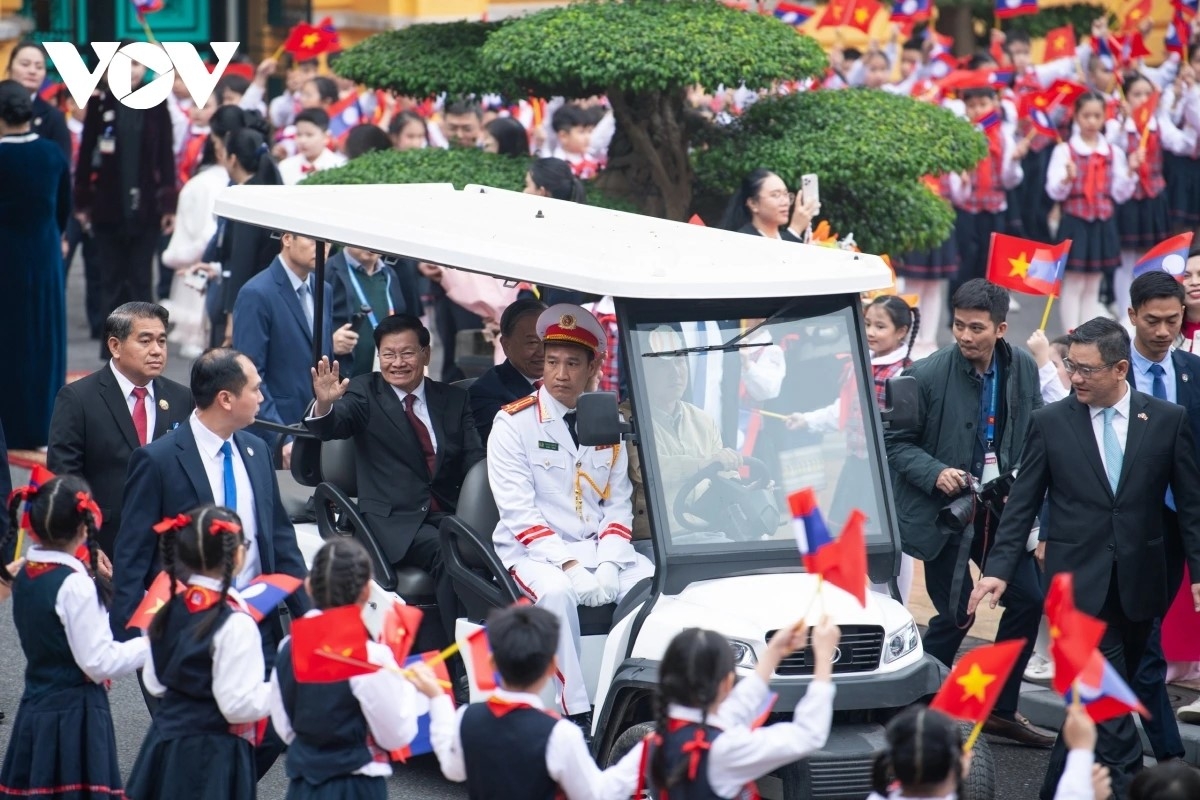 top lao leader thongloun sisoulith warmly welcomed in hanoi on state visit picture 10