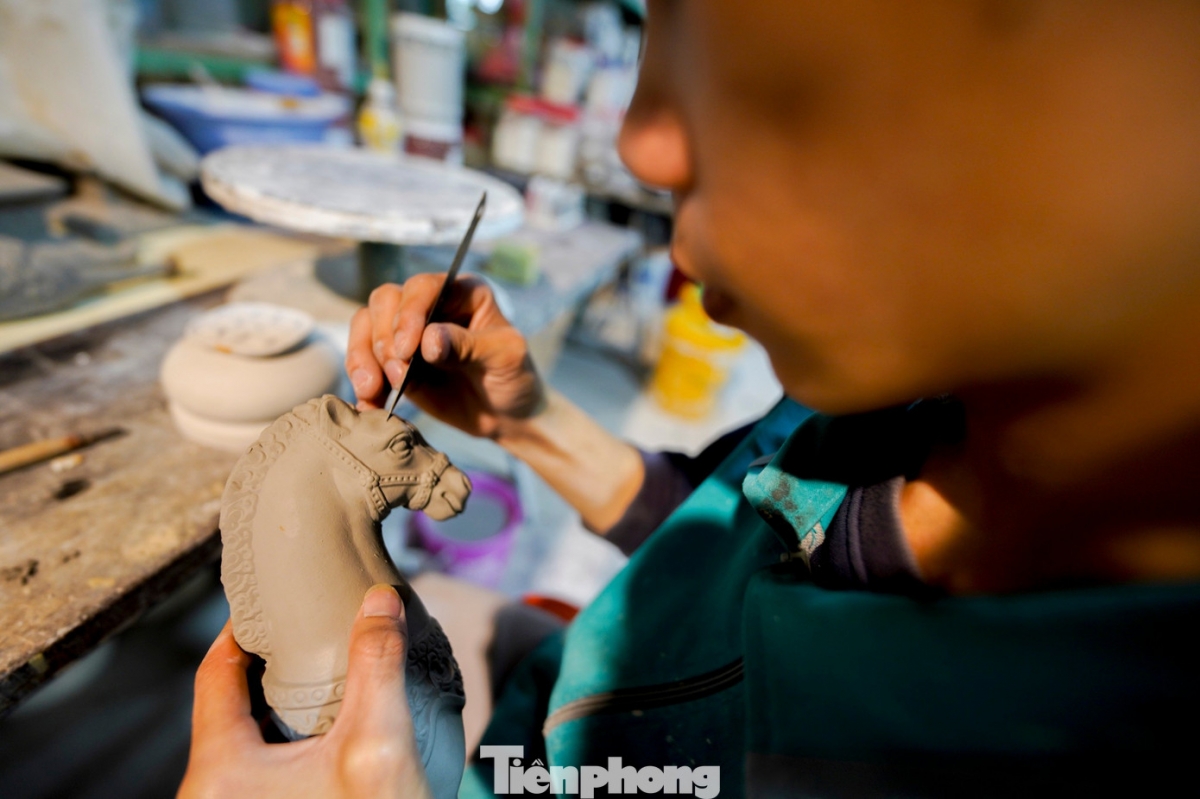 a closer look at a unique collection of ceramic horses for tet picture 14