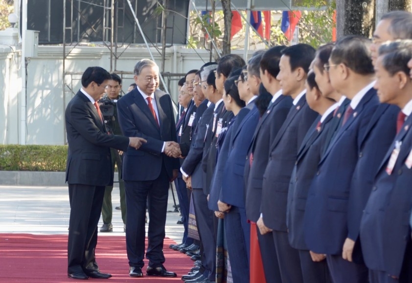top lao leader hosts official welcome ceremony for party chief to lam picture 3