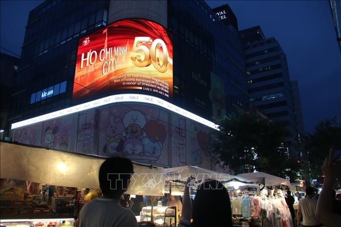ho chi minh city marks 50 years since its renaming with image displays in seoul picture 1