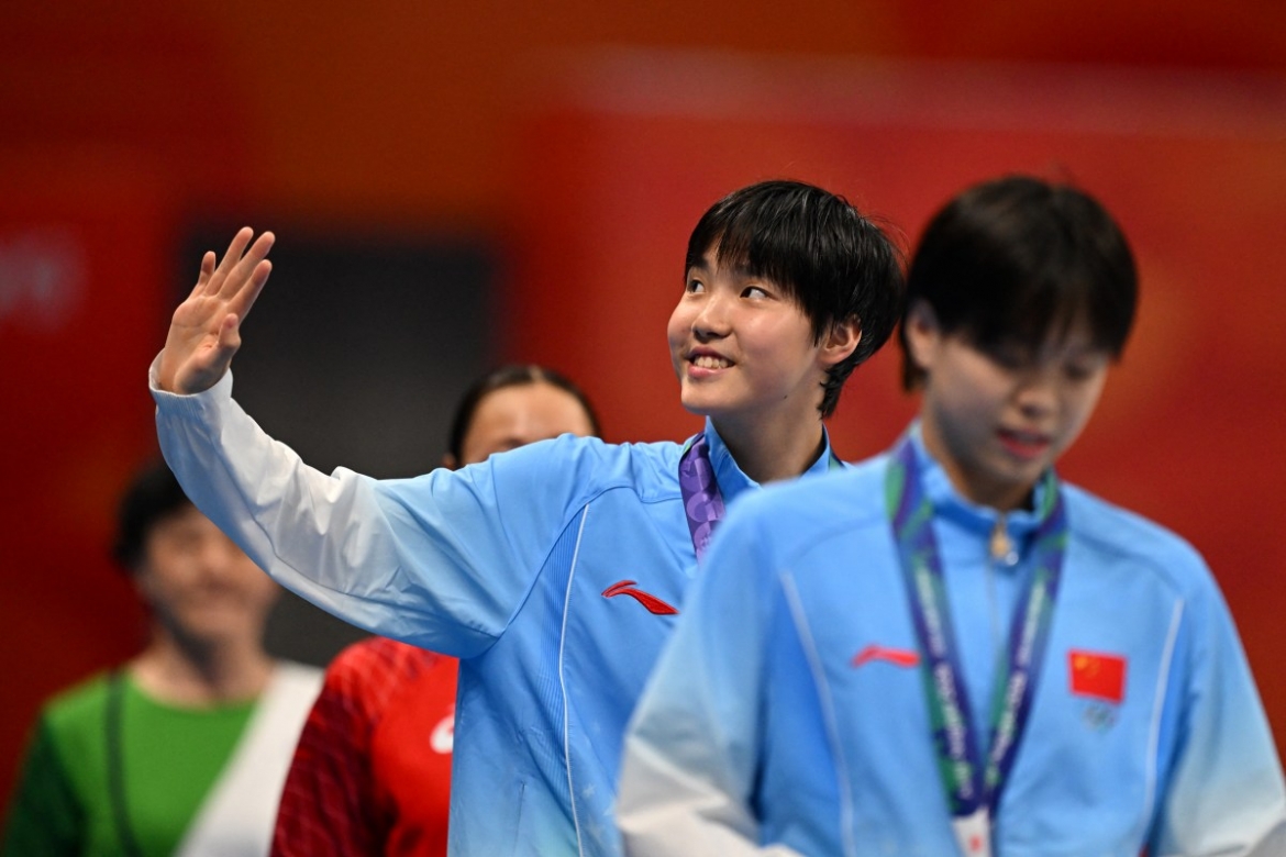 kinh ngu 13 tuoi cua trung quoc gianh 2 hcv asiad 2026 hinh anh 1