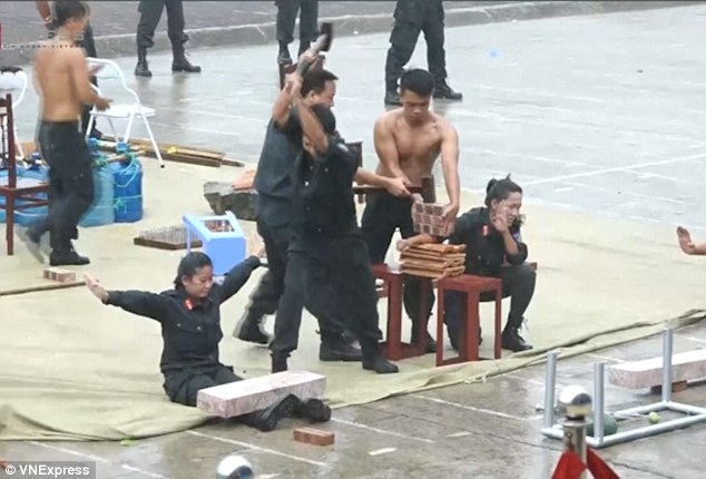 Vietnam's female soldiers smash bricks, bend iron, mean business