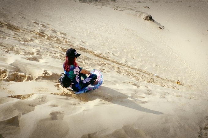 Sandboarding on the sand dunes of Quang Phu in Quang Binh