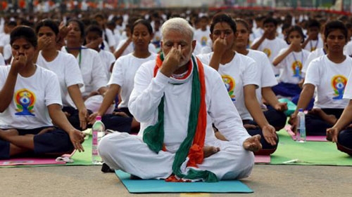 Modi seeks to turn yoga record on its head as India stretches soft power