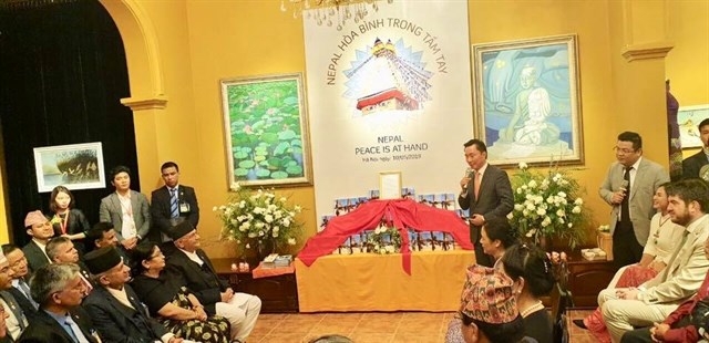Nepali PM witnesses release of book on peace and Buddhism