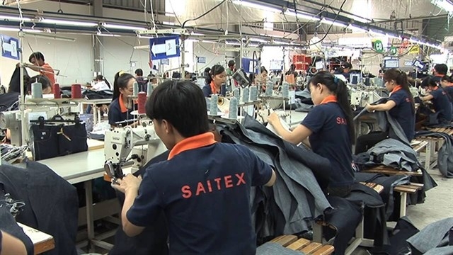 High-level Swiss delegation visits garment factory in Dong Nai