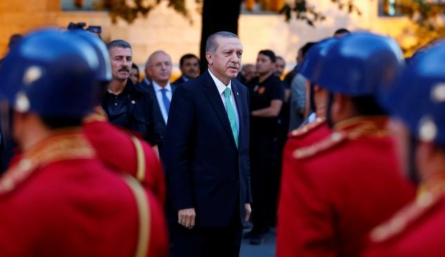 Turkey's Erdogan shuts schools, charities in first state of emergency decree