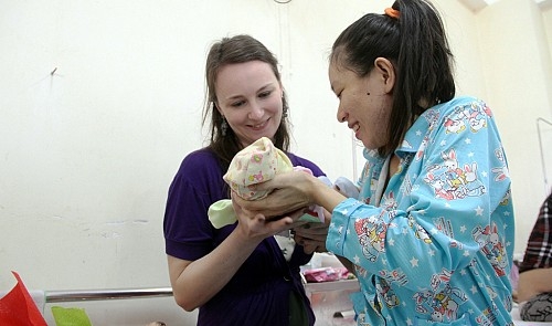 Vietnamese woman, her mid-flight baby reunited with British ‘godmother’