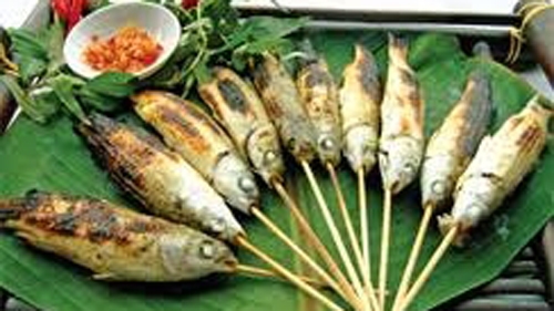 Grilled mullet fish wrapped in lotus leaves