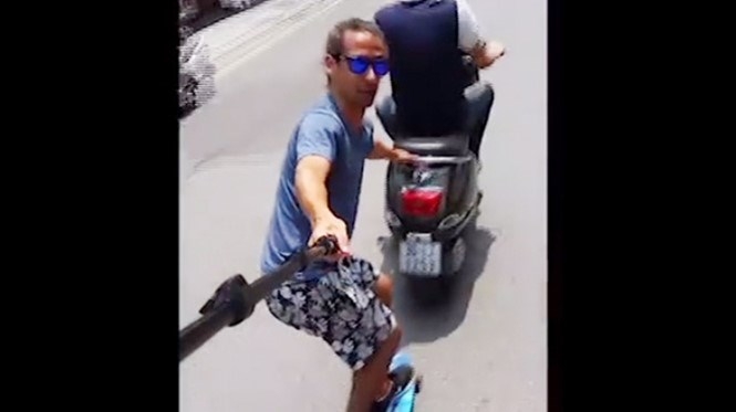 Canadian skateboarder criticized for skitching on Hanoi’s busy roads