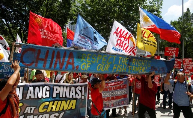 China vows to protect South China Sea sovereignty, Manila upbeat